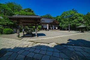 A Japanese traditional temple JINDAIJI at the old fashioned street in Tokyo wide shot photo