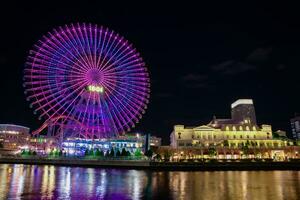 A night illuminated ferris wheel in Yokohama telephoto shot photo