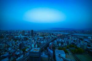 A panoramic cityscape near Yodo river in Osaka wide shot photo