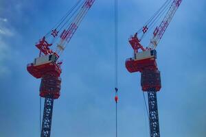 Crane at the top of the building in Tokyo telephoto shot photo