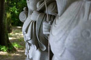 Japanese guardian statues at the traditional street in Tokyo photo