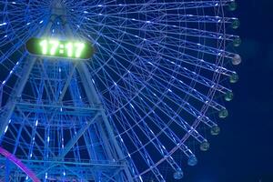 A night illuminated ferris wheel in Yokohama telephoto shot photo