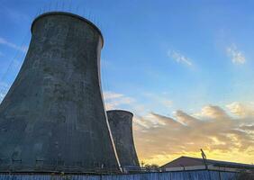 Industrial chimney made of concrete blocks. Concept of preserving the environment and taking care of nature photo