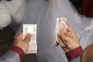 Man counting money with your hands. View from above photo