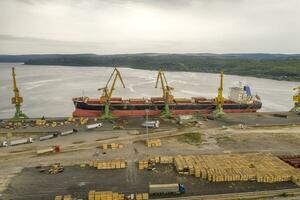 Aerial view from drone of loading the cargo ship. Work in port. photo