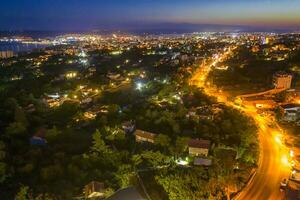 Aerial view from the drone of the illuminated city at twilight. Varna, Bulgaria photo