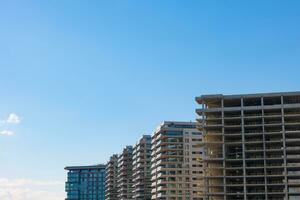 An unfinished construction with high-rise apartments. Economic crisis concept photo