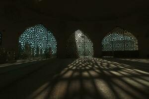 Islamic photo. Shadows of the decoration of window of a mosque photo