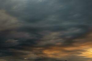 Dramatic clouds at sunrise or sunset. Weather forecast concept photo