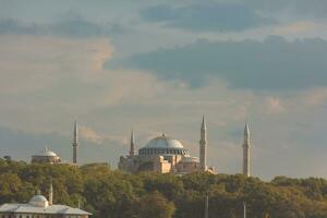 Estanbul antecedentes foto. hagia Sofía o ayasofya mezquita a puesta de sol foto