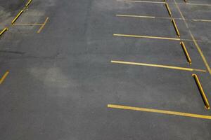 Empty outdoor car parking with yellow laned parking lots photo