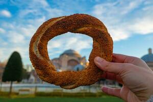 Travel to Istanbul concept photo. Simit or Turkish Bagel and Hagia Sophia photo