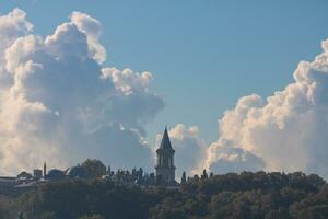 Topkapi Palace with amazing clouds on the background photo