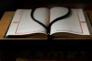 The Holy Quran and praying beads. Islamic photo. photo