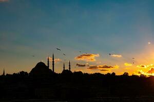 Ramadan concept photo. Suleymaniye Mosque at sunset with partly cloudy sky photo