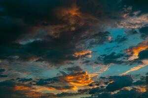 Dramatic clouds at sunrise. Cinematic cloudy sky backdrop or background photo