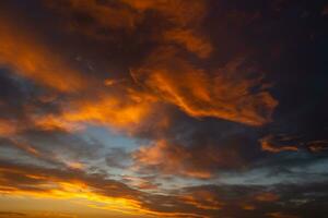 Cloudscape at sunset. Dramatic or cinematic clouds photo