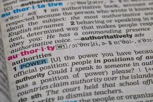 Authority word in the dictionary. Power or control or command concept background photo