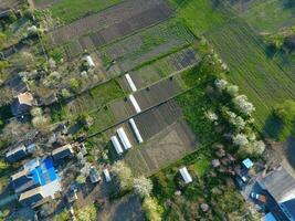 The gardens in the spring. The views are from the top. Greenhouses in the garden photo