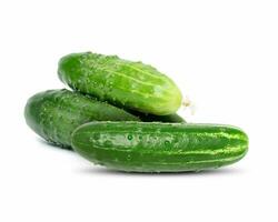 Bunch of green cucumbers on a white isolated background photo