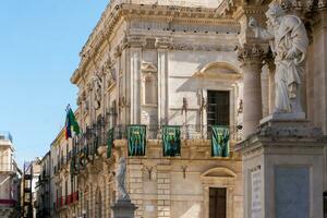 Syracuse, Italy-May 9, 2022-particular of  the buildings in the cathedral square during a sunny day photo