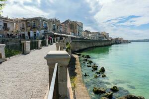 Syracuse, Italy-May 9, 2022-View of the famous pedestrian route located on the Alfeo seafront in Syracuse during a sunny day photo