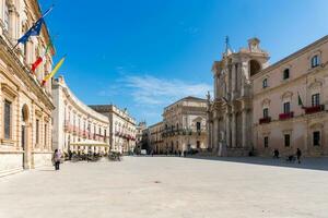 Syracuse, Italy-May 9, 2022-View of the cathedral square with the Cathedral of the Nativity of the Holy Maryduring a sunny day photo