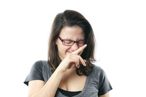 young woman suppressing a sneeze photo