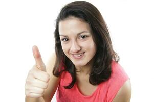 teenage girl giving thumbs up photo