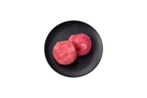 Round shape steaks of raw juicy tuna with salt and spices png