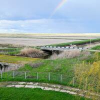 Bridges through irrigation canals. Rice field irrigation system photo