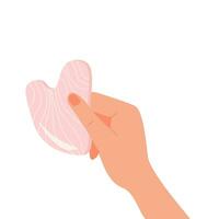 Gua Sha scraping massage tool holding by hand. Natural pink rose quartz stone scraper. Facial massage. Face lifting. Skin care. Trendy beauty treatment. Vector flat illustration isolated on white.