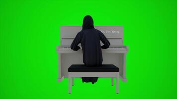 3d green screen an Arab female employee playing the piano in Dubai restaurants from the back angle video