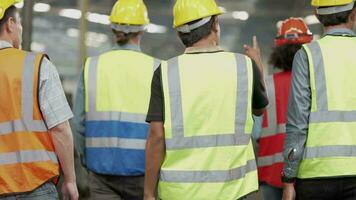 Group of Diversity factory worker people inspecting and checking  local warehouse, asian, white caucasian and asian people in heavy machine at industry factory. Concept Engineer Operating and control. video