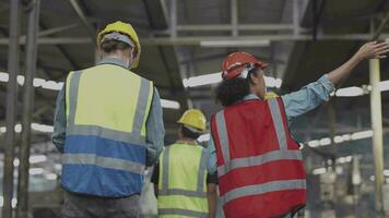 Group of Diversity factory worker people inspecting and checking  local warehouse, asian, white caucasian and asian people in heavy machine at industry factory. Concept Engineer Operating and control. video