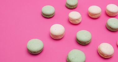 Sweet, tasty and delicious macaroons dessert on pink background video