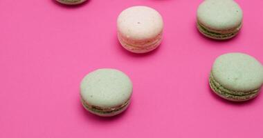 Tasty and sweet macaroons dessert on pink background video