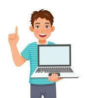 Young man holding laptop with empty screen pointing finger for copy space vector