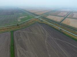 Crossroads paved roads through the fields. View from above photo