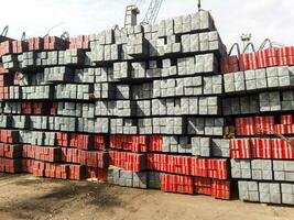 Metal square rods. Warehouse of metal ingots photo