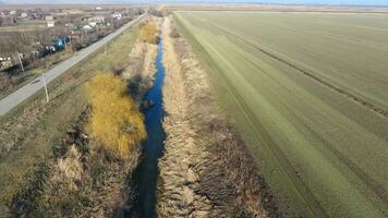 The channel of the lower level of the irrigation system of fields. Infrastructure for the cultivation of rice photo