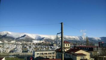 Terrestrial warehouses and storage facilities near the seaport. A view of the mountain peaks photo