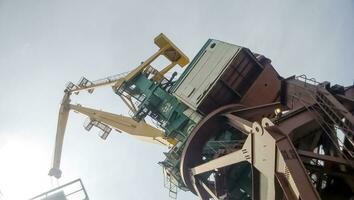 View from the top to the top of the port tower crane. Industrial port photo