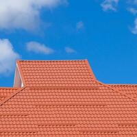 The roof of corrugated sheet red orange photo