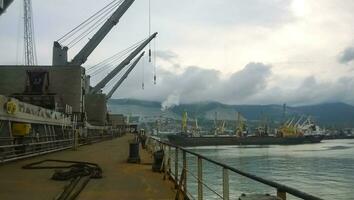 The type of port cranes in the background of the landscape of the port and port area photo