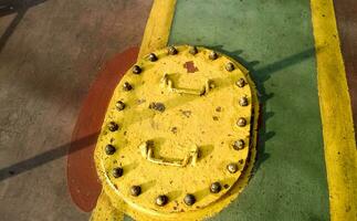 Technological hatch on the deck of the ship. Service inputs. photo