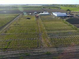 Frameworks of greenhouses, top view. Construction of greenhouses in the field. Agriculture, agrotechnics of closed ground photo