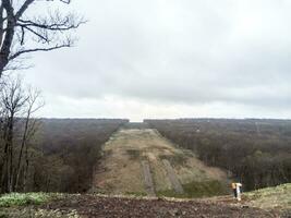 A clearing in the forest for the gas pipeline photo