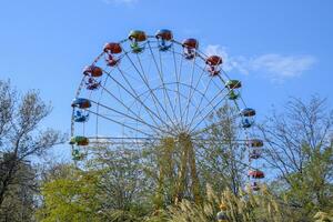 Ferris wheel. Ferris wheel in the city park. Seats for passengers on the ferris wheel photo