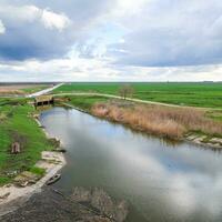 Bridges through irrigation canals. Rice field irrigation system photo